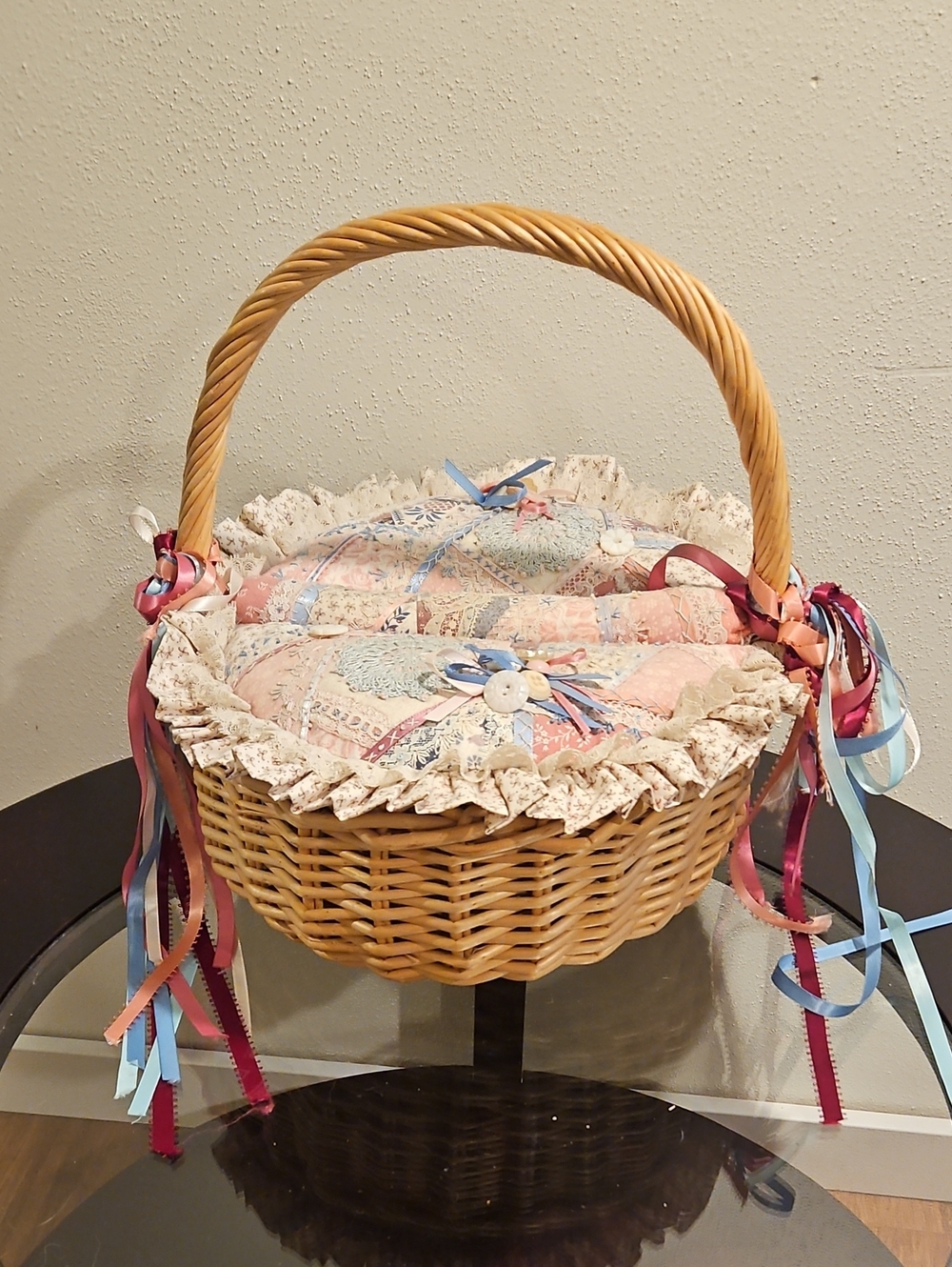 Wicker Basket with Patchwork Lined Cushion and Ribbon Accents